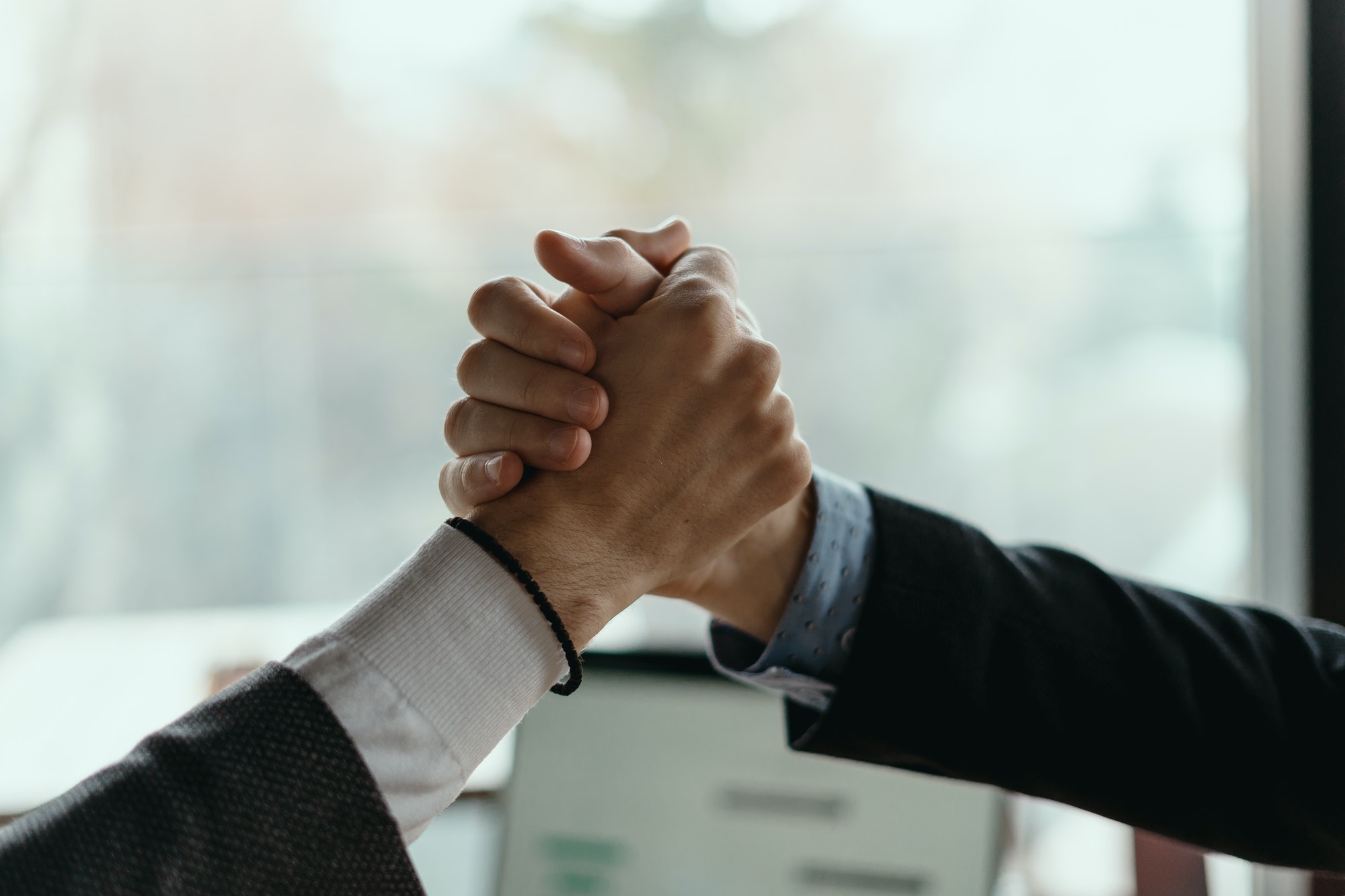 Two business men celebrating a deal